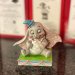 Disney-figur av en sittende Dumbo
